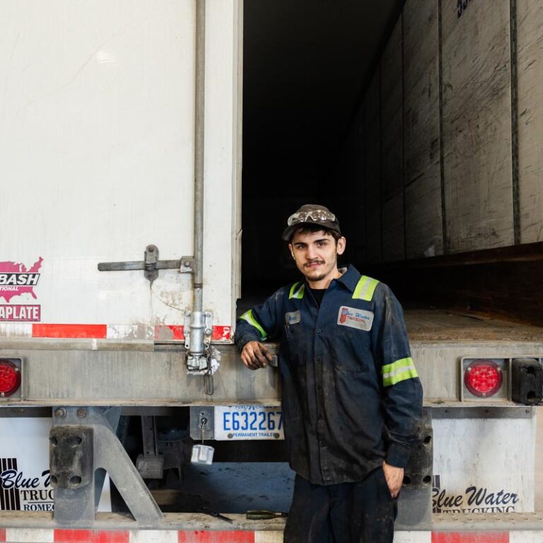 Truck driver next to door